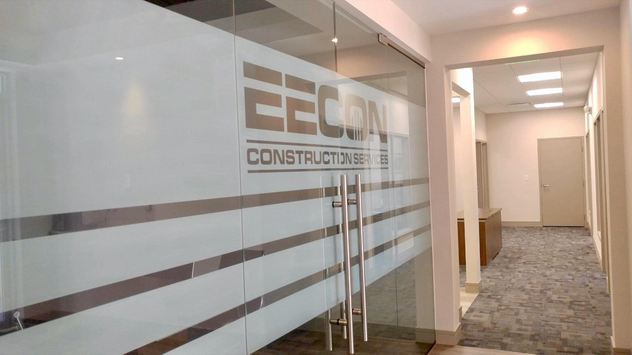Branded deco film on storefront of Eecon Construction Services. Naples, FL