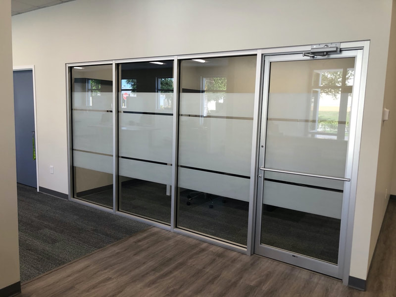 Privacy window film installed in conference room at Quality Cabinets and Counters in Fort Myers